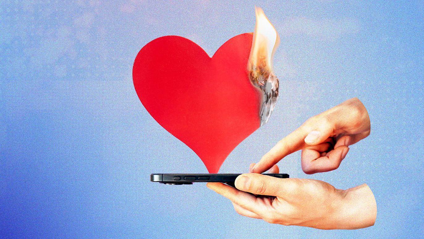 Coraz&oacute;n que arde saliendo de un tel&eacute;fono 